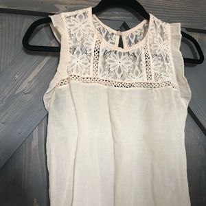 Cream colored top with lace accents